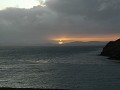 Zonsondergang boven de baai.  Gezien van bij de ca