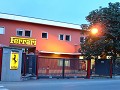 Ferrari factory entrance at dusk