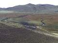 zicht op de vallei met grazende yaks vanaf de noma