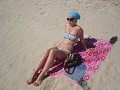 Corona sunbathing at beach in Colonia...