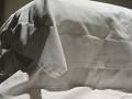 Klein detail op het bed