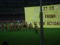 Teams run through these banners at start of match.