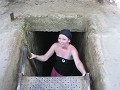 Emily exiting the Cu Chi tunnel after a harrowing 