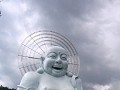 A laughing Buddha outside one of the temples