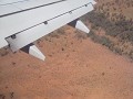 De schaduw van ons vliegtuig.